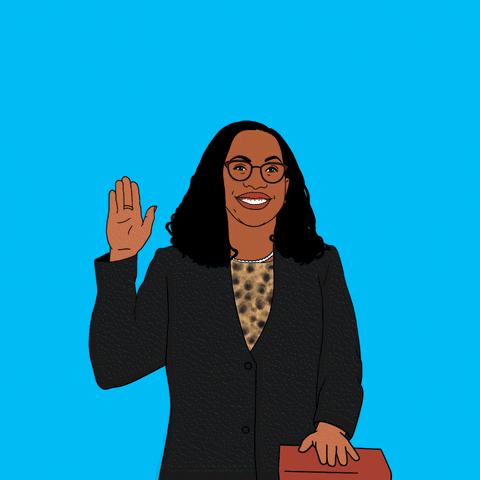 Digital art gif. Illustration of Supreme Court Justice Ketanji Brown Jackson smiling and raising her right hand, her other hand placed on a Bible. White text above her head reads, "The first Black woman on the U.S. Supreme Court," all against a blue background.