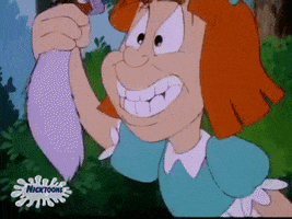 Cartoon gif. In a scene from Tiny Toon Adventures, Elmyra Duff has caught a gray squirrel with an acorn in its mouth to be her latest pet. As usual, she hugs it and rubs it against her cheek, but the squirrel doesn't look too happy about this. As Elmyra dreamily talks out loud to herself, the squirrel spits out its acorn and tries to pry itself out of her hands with a crowbar, but the crowbar snaps. The squirrel then bites Elmyra's hand, but she doesn't seem to notice. Elmyra kisses the squirrel several times, and it looks dazed as she holds it up and cheers.