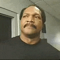 Video gif. A man with a moustache looks angry offscreen and shouts: Text, "Damn!"