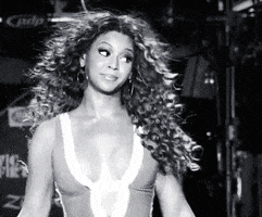 Video gif. A black-and-white clip of Beyonce dancing while ignoring someone offscreen, as if to say "whatever".