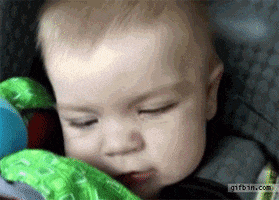 Video gif. Baby cries into his toy. When the car goes through the tunnel, turning its surroundings dark, the baby's face reappears, eyes wide in complete shock.