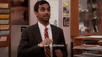 Parks and Recreation gif. Aziz Ansari as Tom makes a "stop" sign with his hands, his palms parallel to the floor. "No, we're done-zo," he says, which appears as text.