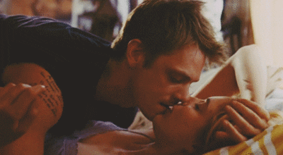 love couple adorable kissing bed GIF
