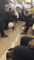 Trombone Players Perform Solemn Song on Tokyo Subway