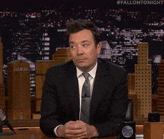 The Tonight Show gif. Jimmy Fallon pouts and upturns his hands and shrugs as if he has no clue. 