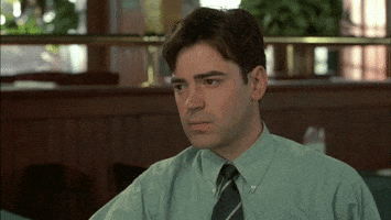 Movie gif. Ron Livingston as Peter in Office Space looks around, closes his eyes, then opens them with a sigh.