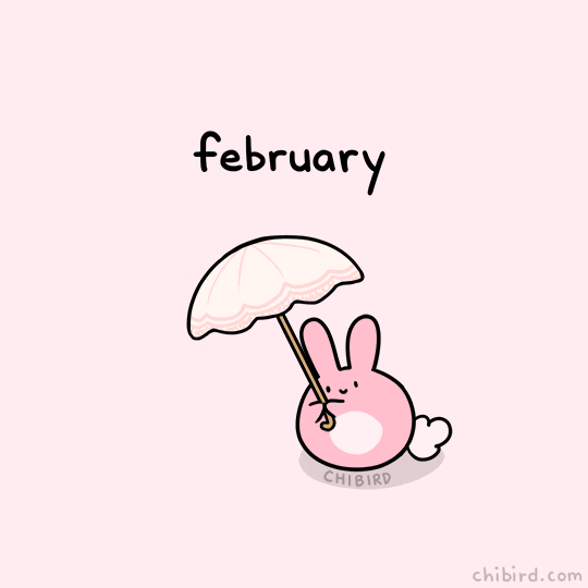 Kawaii gif. A pink bunny holds an umbrella over its head and red hearts fall on the umbrella. Some hearts fall on the floor and some hearts fall on the bunny, who smiles and blushes every time a heart hits it. Text, “February.”