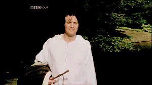 Gif of Mr Darcy walking through a garden with a wet shirt having just fallen in the pond