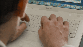 Video gif. A man is typing on his laptop and we see his hands from his perspective as they clack away.