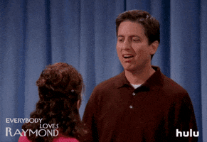 TV gif. Ray Romano as Ray on Everybody Loves Raymond. He's pointing a finger at a woman and opens his mouth, challenging her statement before smiling and looking away.