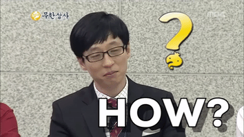TV gif. Wearing a black suit with a red striped tie, Yoo Jae-suk of Infinite Challenge turns his head to the side. With a playful grin, he asks us: Text, "How?" A yellow question mark with a dot appears next to him.