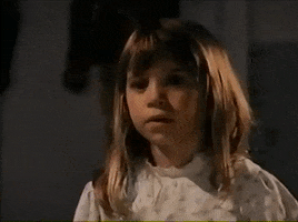 Movie gif. One of the Olsen Twins in Double Double Toil and Trouble looks over to the left and puts a finger up to her chin as she thinks.