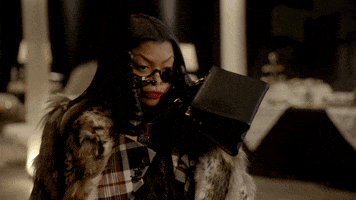 TV gif. Taraji P Henson as Cookie Lyon in Empire flips up her sunglasses with a 'told-you-so' energy. 