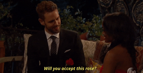 Bachelor asking contestant "Will you accept this rose?"
