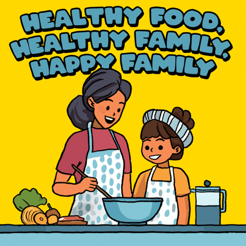 Family sitting down together and happily sharing a healthy home-cooked meal