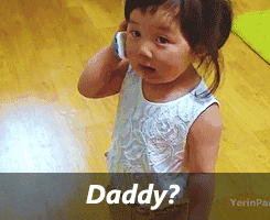 Video gif. A toddler holds a phone up to her ear. Text, "Daddy?"