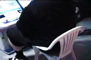 Video gif. A heavy set man sits in a plastic yard chair as it buckles underneath him and he crashes to the floor. 