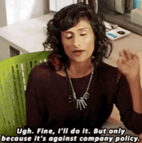 TV gif. Sarayu Blue as Kareema in No Tomorrow reluctantly swivels in her office desk chair, saying "Ugh. Fine. I'll do it. But only because it's against company policy."