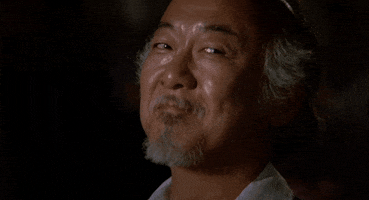 Movie gif. Pat Morita, as Mr. Miyagi from The Karate Kid (1984), nods at us approvingly.