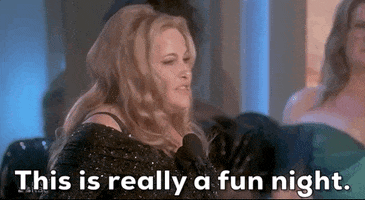 Video gif. Jennifer Coolidge accepts an award at the Golden Globes as she looks around with a bit too much intensity and maybe a touch of insincerity, "This is a really fun night."