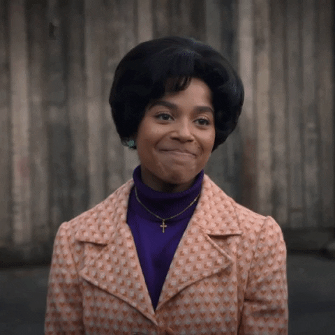 TV gif. Smiling, Leonie Elliot, as Lucille in Call the Midwife waves a bittersweet goodbye.