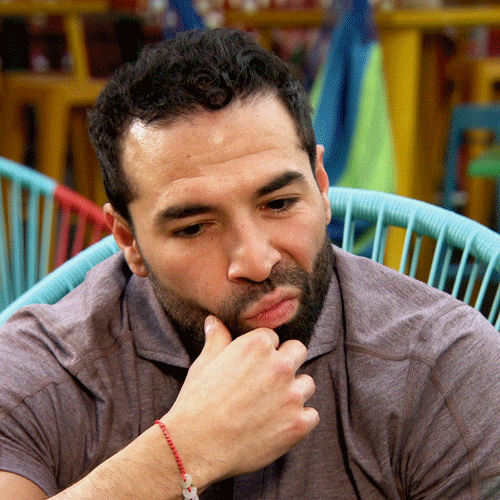 Reality TV gif. Jose from Married at First Sight purses his lips and nods his head, stroking his beard, like he is listening and thinking.