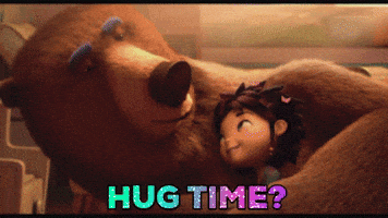 Cartoon gif. The bear and Mackenzie from Animal Crackers hug on a floor. The bear asks, "Hug time?" and Mackenzie leaps into his arm and they snuggle closely. 