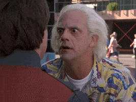 Movie gif. Christopher Lloyd as Doc Brown from Back to the Future gets in Marty's face, eyes wide and wild says, Why?