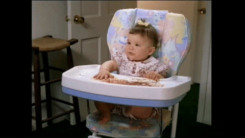a baby in a high chair