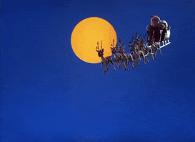 TV gif. Led by eight reindeer, Santa flies his sleigh through the night in front of a full moon in A Year Without Santa Claus.