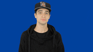 Celebrity gif. Brendon Urie chews gum, and shrugs his shoulders while nodding enthusiastically.