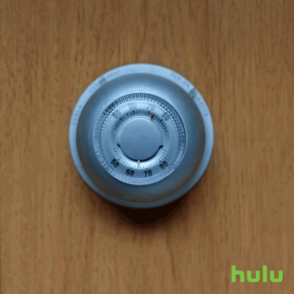 Video gif. We see a thermostat that's being adjusted by two people who have differing tastes in temperature. A hand with painted nails adjusts it hotter while an unpainted hand adjusts it cooler.