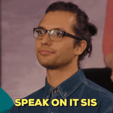 Video gif. A man wearing glasses, with his hair pulled back in a bun, nodding righteously. Text, "speak on it, sis."