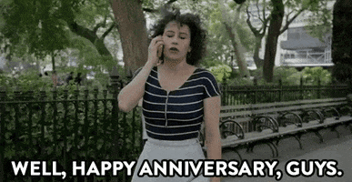 TV gif. Ilana Glazer, as Ilana from Broad City, stands in a city park and sighs, having had enough of her phone conversation. Text, "Well, happy anniversary, guys."