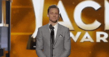 tom hiddleston laughing GIF by Academy of Country Music Awards 