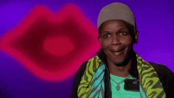 Reality TV gif. A contestant from RuPaul's Drag Race is guffawing during their interview.
