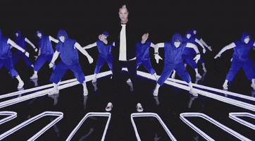 Music video gif. Fitz and The Tantrums are clapping in sync during a music video. The backup dancers are dressed in blue hoodies and sweatpants.