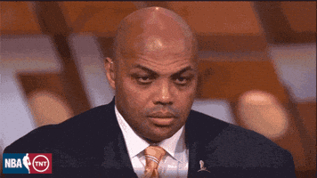 Sports gif. Charles Barkley, wearing a suit on air, slowly closes his eyes, succumbing to sleep on the job. Wake up, Charles!