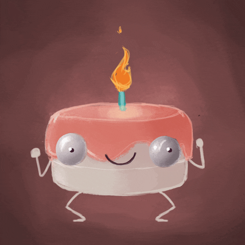 Pohyblivý obrázek se skákajícím dortem s obličejem, končetinami a hořící svíčkou na vrcholu. 