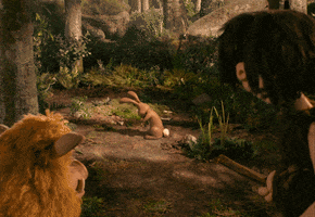 Movie gif. We zoom in on a claymation rabbit in Early Man. It startles and looks up toward us before smiling and baring its fangs. 