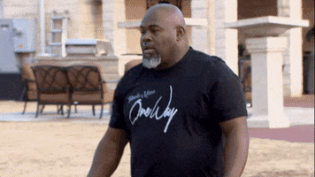 TV gif. David Mann as Leroy in Meet the Browns backs away then runs from a man chasing him. He glances over his shoulder before hooking a left and darting away. 