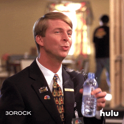 TV gif. Jack McBrayer as Kenneth Parcell from 30 Rock lifts a plastic water bottle to his lips, his hand shaking violently. The water spills everywhere, all over his clothes, as he attempts to drink. He's obviously nervous and scared--of what, we don't know. 