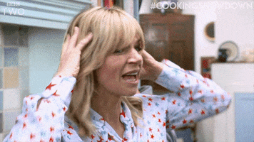 Reality TV gif. Zoe Ball on Big Family Cooking Showdown yelling and pulling her hair up like she's threatening to pull it out.