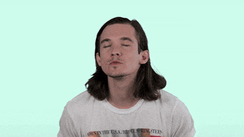 Celebrity gif. Chris Farren does numerous passionate air kisses as red animated smooches appear and disappear in the air. 