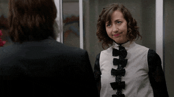 Movie gif. Kristen Schaal as Carol in The Last Man On Earth. She regards what the other person is saying by tilting her head and thinking deeply as she purses her lips and nods slightly.
