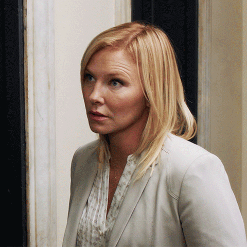 TV gif. Kelli Giddish as Amanda Rollins on Law and Order: SVU rolls her eyes in annoyance and walks away.