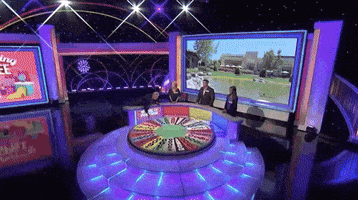 spinning the wheel GIF by Wheel of Fortune