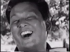 black and white laugh GIF