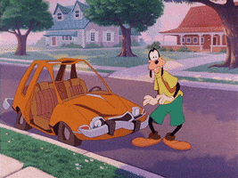 Disney gif. In A Goofy Movie, Goofy stands in front of an orange car with a bent fender and points his thumb at it, smiling, then the car explodes, leaving behind the seat and Goofy's shoes.