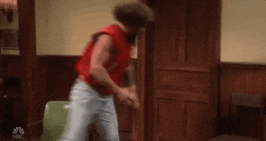 SNL gif. Jason Momoa wears a sports letterman with no arms. He picks up a wooden chair and bashes it against the wall in a fury of rage.